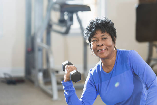 istock Mature black woman exercising at gym 826909272