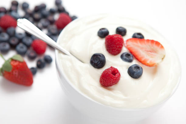 istock Bowl of cream with fresh berries 826914320
