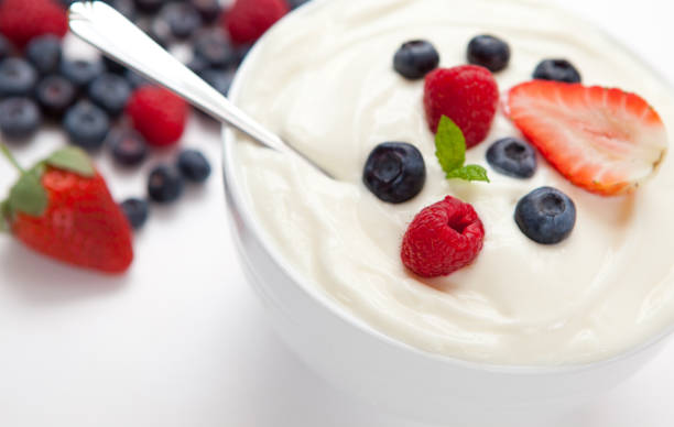 istock Berries in a bowl with cream 826914346