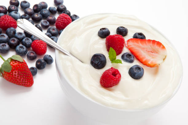 istock Bowl of cream with different berries 826914356