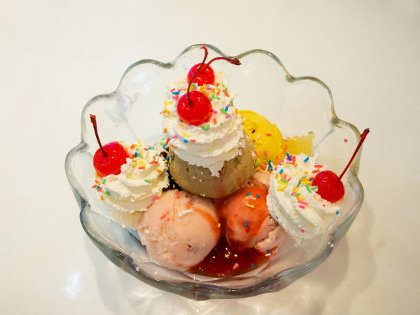 istock Ice cream scoops with whipped cream and cherry 826917058