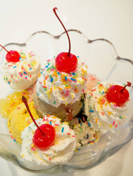 istock Ice cream scoops with whipped cream and cherry 826917074