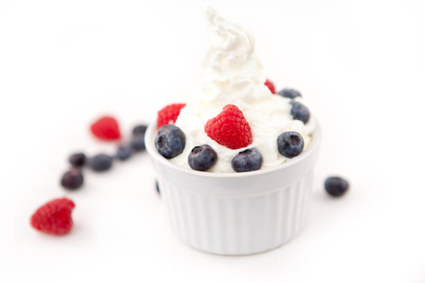 istock Dessert of berries and whipped cream 826924630