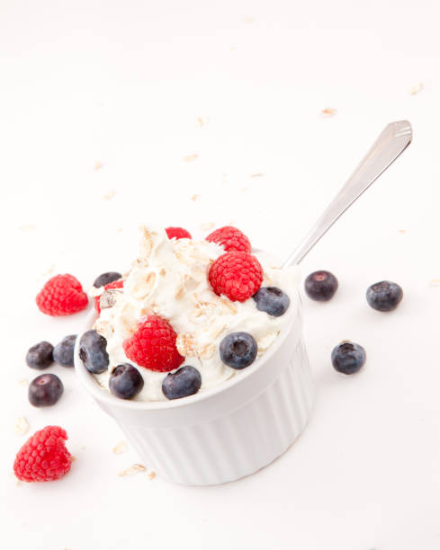 istock Whipped cream mix with berries and spoon 826924646