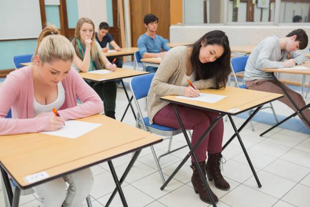 istock People sitting at the exam hall 826928590