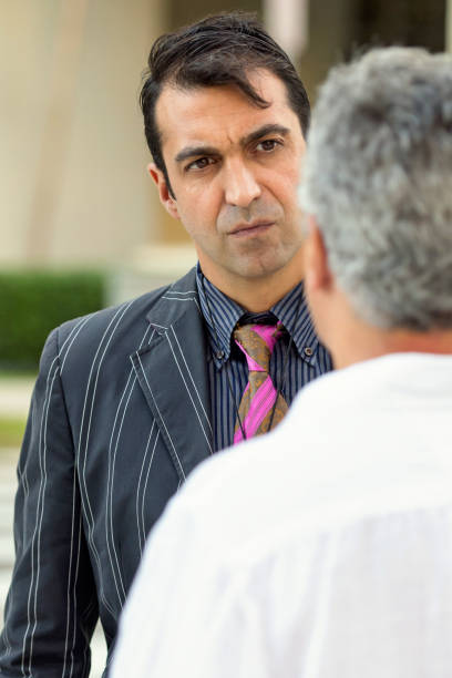 istock Two mature business men talking 826928674