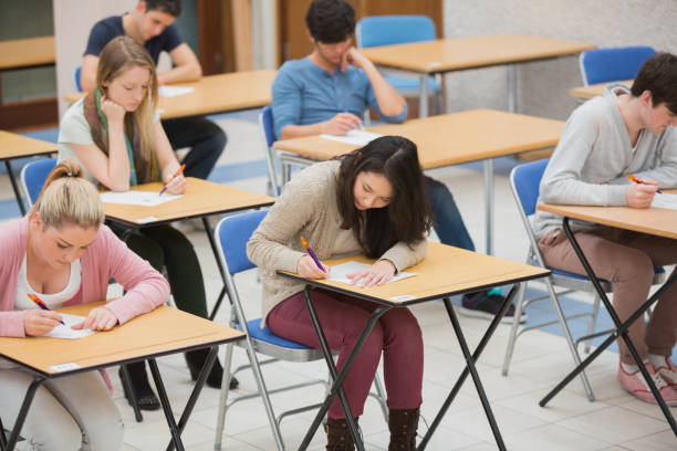 istock Students writing in the exam hall 826928750
