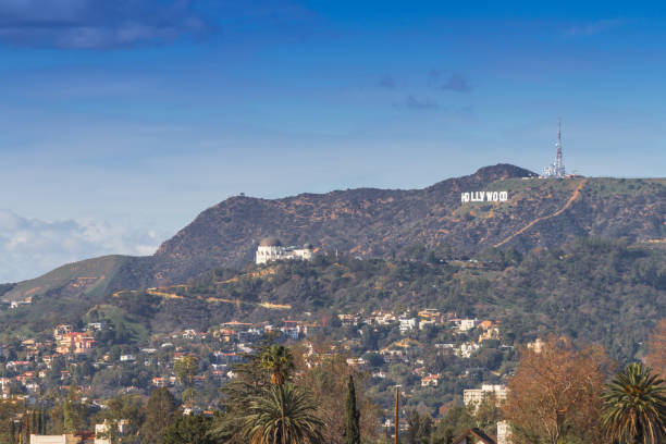 Hollywood California, USA 1/21/2017 The Hollywood Sign is a famous landmark in the Hollywood Hills area of Mount Lee in the Santa Monica Mountains. Griffith Park mountains with Hollywood sign and observatory on a sunny day in California during a special event at the Observatory.