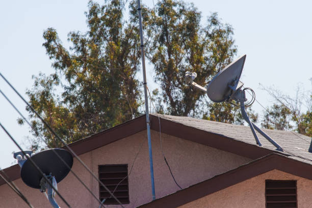 istock Satellite antenna on house roof 826946218