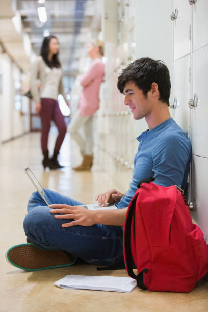 istock Man sitting on the floor at the hallway 826947124