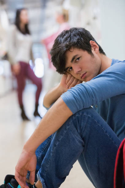 istock Man sitting on the floor looking 826947146