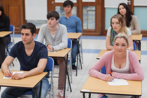 istock Students sitting in the exam room 826947172