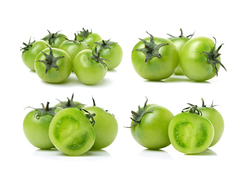 Green tomatoes on the white background