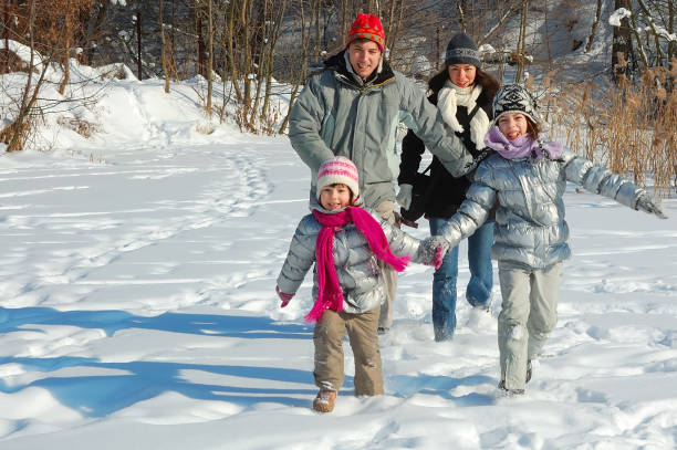 istock Happy family in winter, having fun with snow outdoors on weekend 826954716