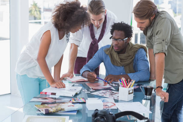 istock Team of photo editors having brainstorming session 826954734