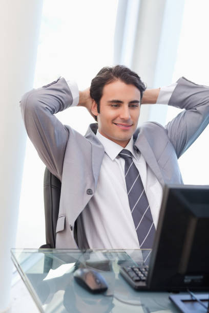 istock Portrait of a relaxed businessman working with a computer 826963204