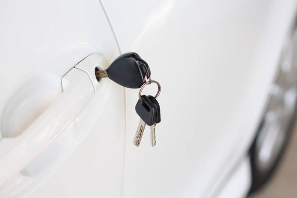 istock Car keys left in the car door 826963478