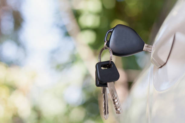 istock Car keys left in the car door 826963490