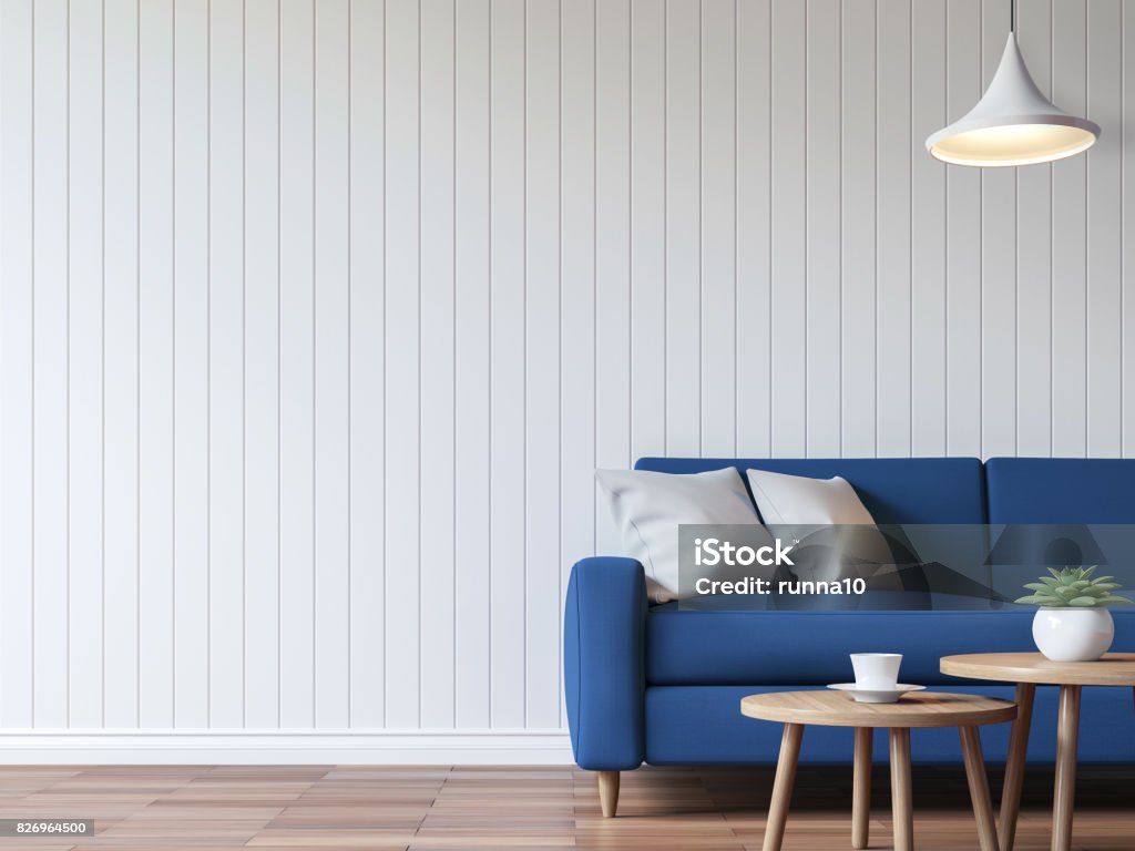 Modern white living room vintage style  3d rendering image Modern white living room vintage style  3d rendering image.There are wood floor decorate wall with white wooden plank .Furnished with blue fabric sofa. Blue Stock Photo