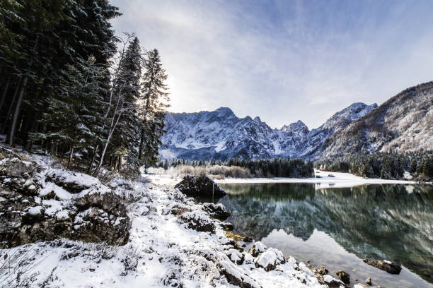 istock first snow at the mountain lake 826967240