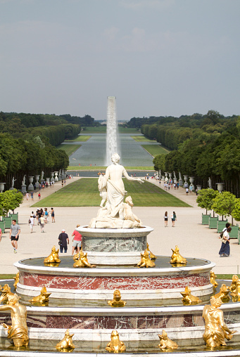 Paris, France -July 20,  2016: Latona fountain  restored in 2015 in Versailles gardens and a long open section colled The Grand Canal that is 1.670 metres long.