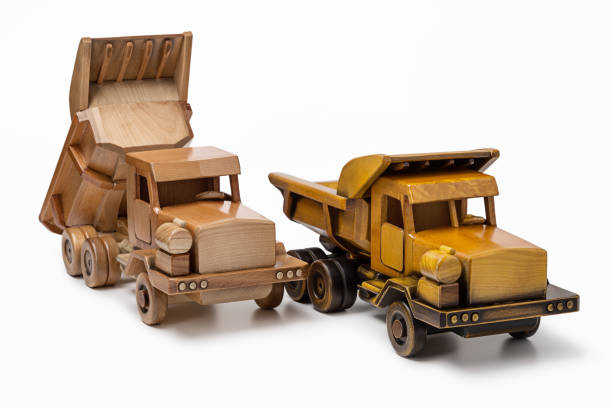 istock Two car dumper wooden toy model, isolated on white background. 826970360