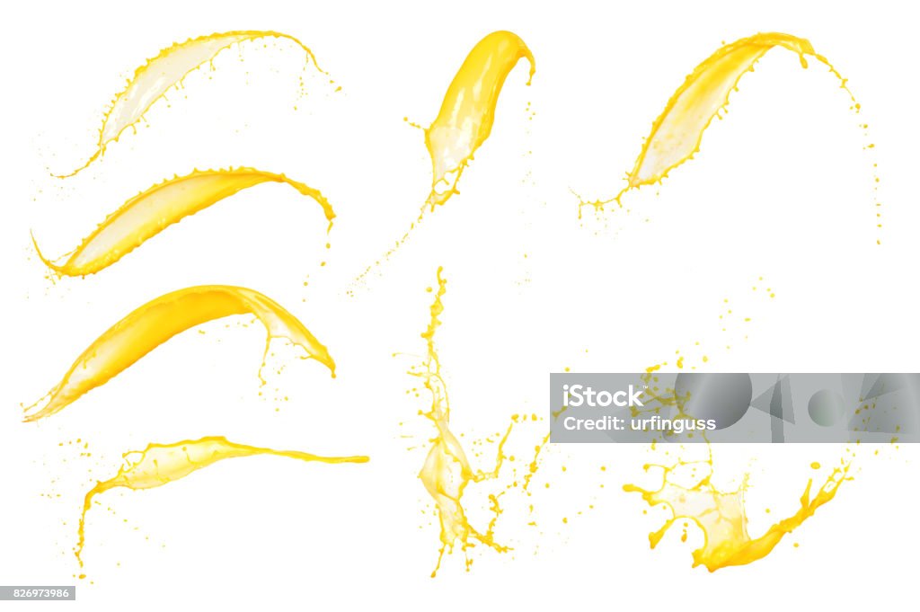 Set of orange juice splashes isolated on white background Splashing Stock Photo