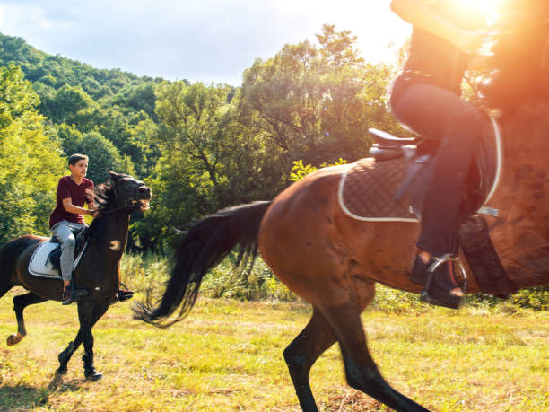 istock Mother and son Riding Horseback Together 826974360