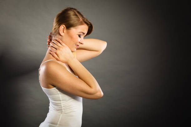 istock Woman suffering from neck pain 826974824