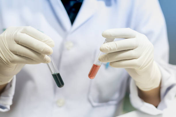 istock Laboratory technician injecting liquid into a microtiter plate, Scientist working at the laboratory, blood analysis, Vintage color. 826977212