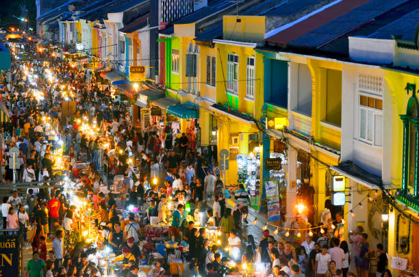 Sunday evening street food market at Thalang Road in Phuket Old Town Each Sunday in the end of the afternoon a huge street food market takes place in the whole Thalang Road - thanon Thalang in Thai - in Phuket Old Townn Thailand, till late in the night. phuket province stock pictures, royalty-free photos & images