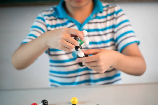 Picture of isolated vitamin C made by molecular model with reflection on white background. Ascorbic acid chemical formula with colored atoms and bonds.