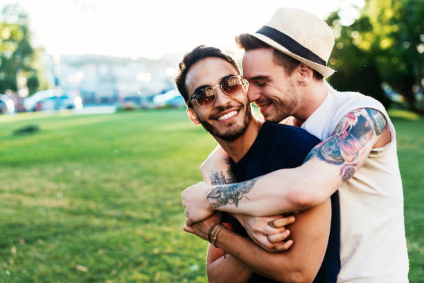 istock Multi ethnic gay couple kissing and hugging 826978362