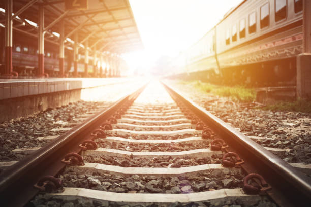 istock Railroad at train station with sunset, vintage tone 826978422
