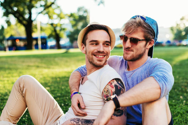 istock LGBT couple relaxing in park 826985638