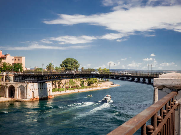 the taranto swing bridg the taranto swing bridge on the taranto canalboat that separates the big sea from the little sea taranto stock pictures, royalty-free photos & images