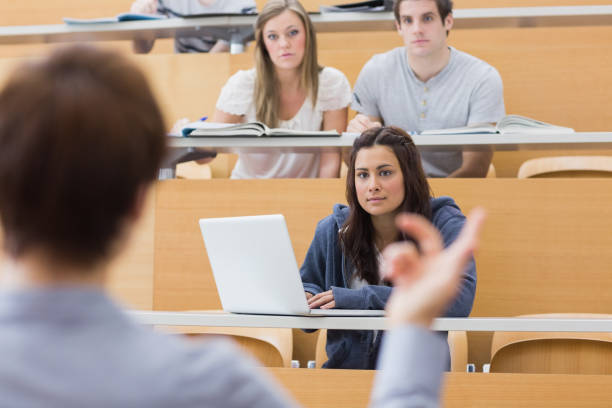 istock Students sitting listening to the teacher 826990838