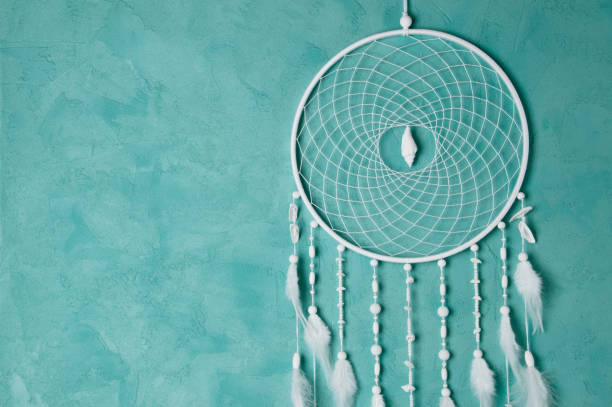 istock White dream catcher on aquamarine 826993382