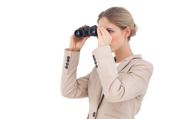 istock Businesswoman looking away with binoculars 826996338