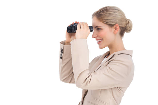 istock Smiling businesswoman looking away with binoculars 826996354