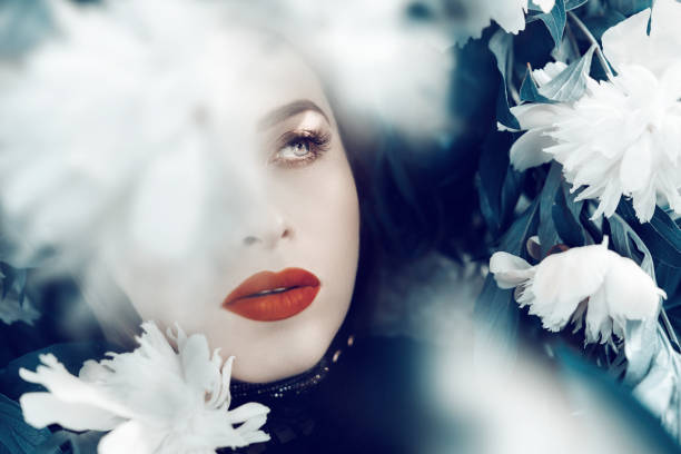 istock white peony surrounding her portrait 827000574