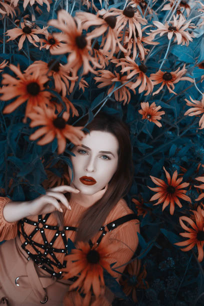 istock fashion model surrounded by flowers 827000576