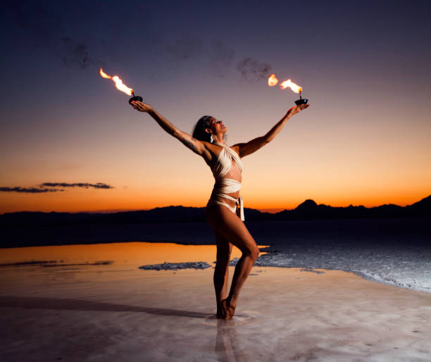 istock Woman Fire Dancer at the Salt Flats During Sunset 827000622
