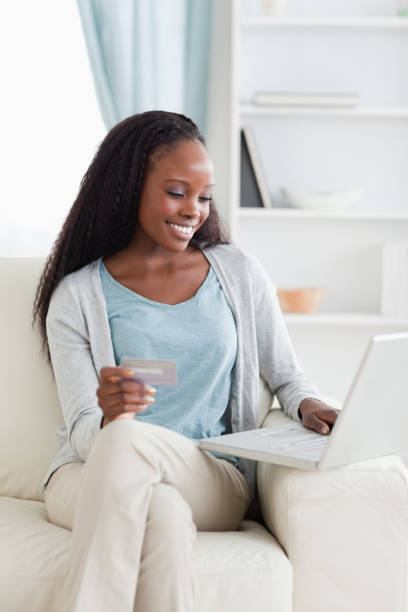 istock Woman shopping online on couch 827003640