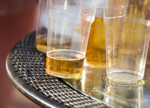 istock Beer in a plastic glass on the table 827004076