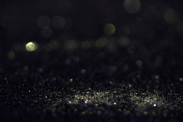 istock Bokeh glitter fly and lights on black 827007284