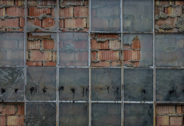 istock The old brick wall with glass of window 827007540