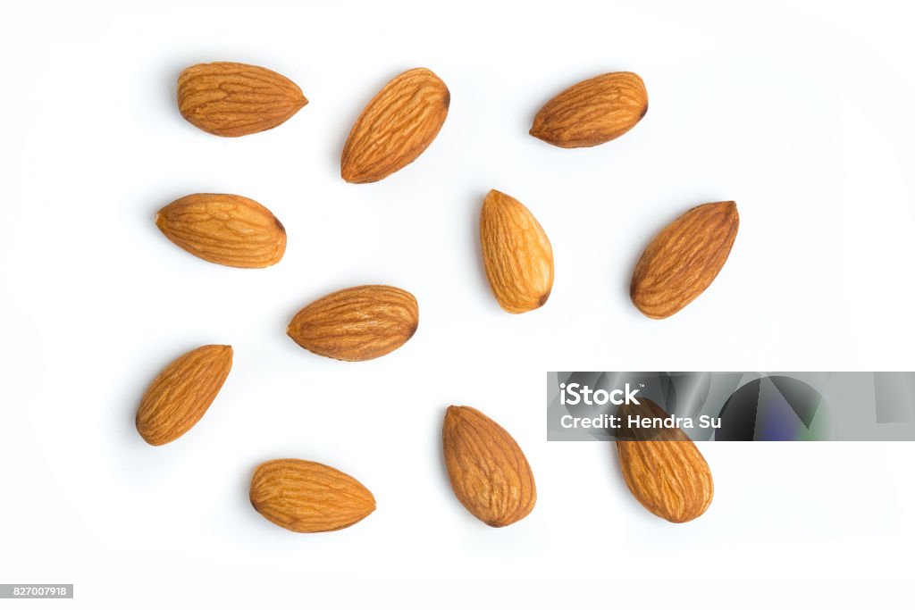 Almond nuts on isolated white background Group of organic almond nuts with isolated white background Almond Stock Photo