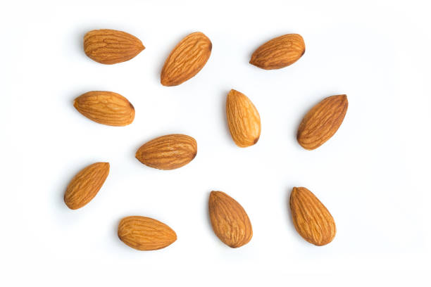 Almond nuts on isolated white background stock photo