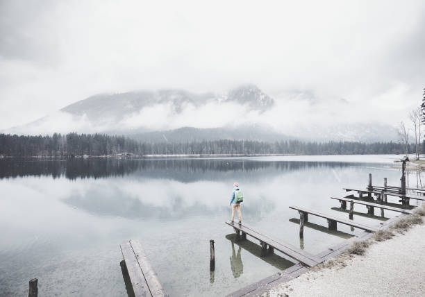 istock Tourist at winter mountain lake 827014074